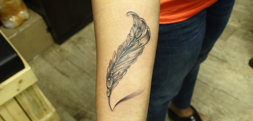 Beautiful Simple & Subtle Feather Tattoo - Inked By Black Poison Tattoos