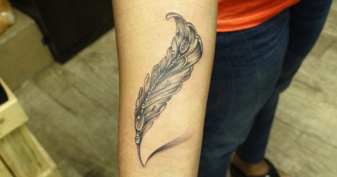 Subtle Feather Tattoo